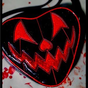 Red and black vinyl Halloween bag beautifully made ! Never used!!!